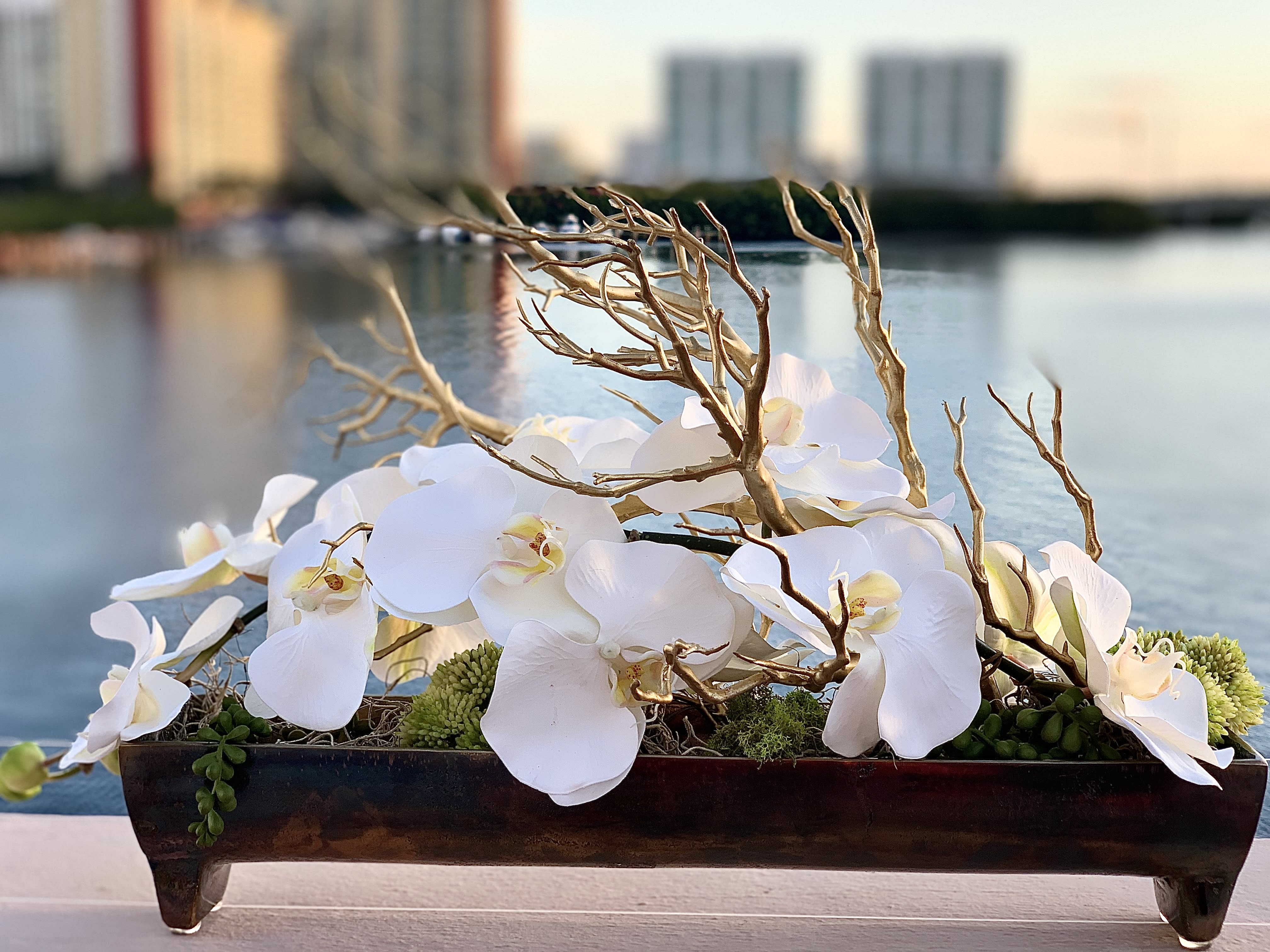 Sweetheart - Silk orchids with golden driftwood in a vase. Costom made. Beautiful decor for your home.   Silk flowers are crafted from a protein fibre spun by the silk worm, producing lifelike flowers. Flowers described as being made of silk with a "real touch technique" are not made of silk, but rather are made of polyester, polymers and plastics.  Pre order 2 days.  ▪️ Delivery to their door Each bouquet is unique and is prepared by an expert florist and our customer service team is at your service to ensure the best experience possible.  ▪️Bouquets you can enjoy for longer Some flowers arrive a little closed to ensure extra freshness and protection during shipping. Enjoy the magic of seeing them fully bloom.