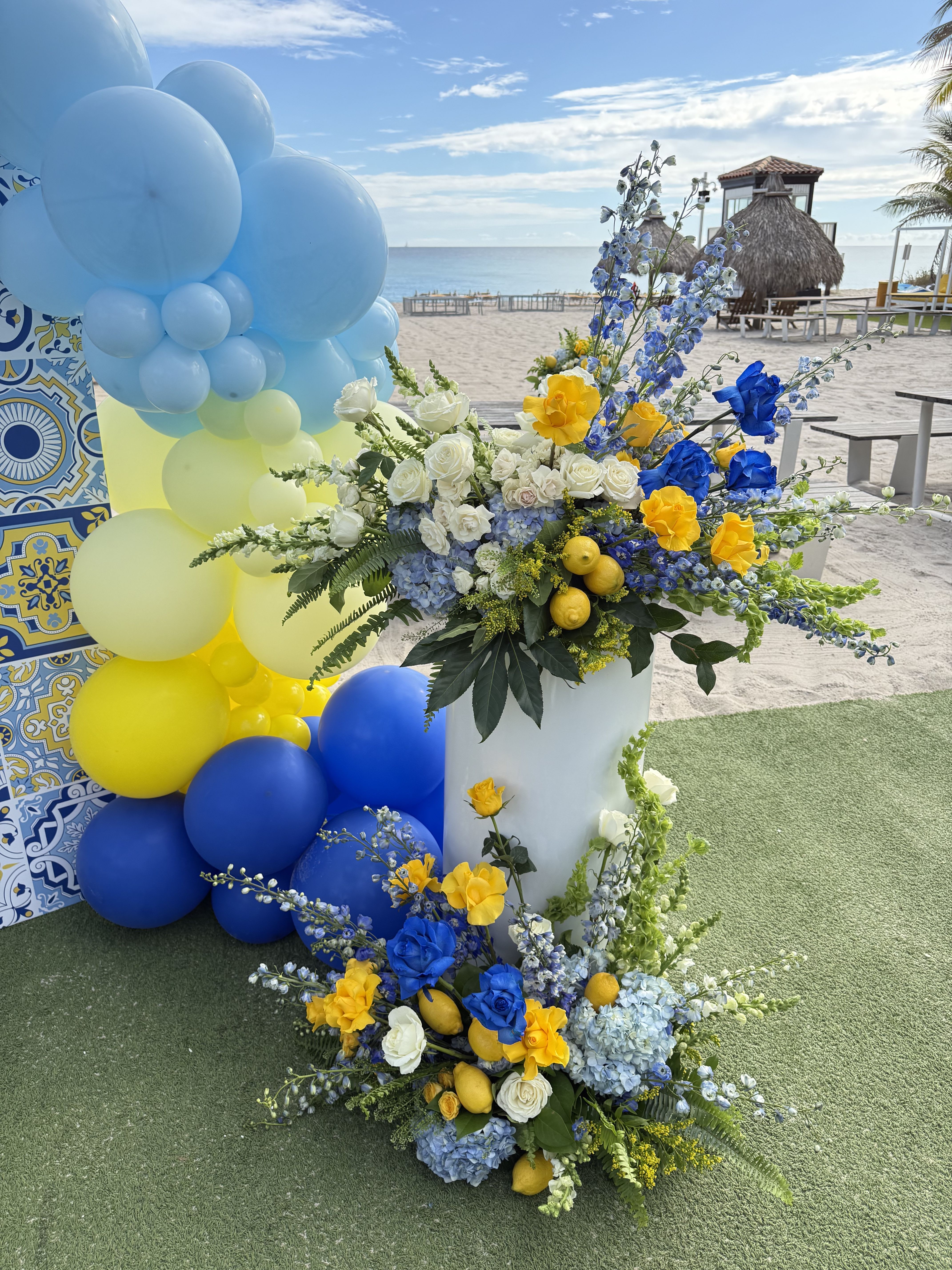 Blue and yellow design decoration - This style fits for Italian design, also adding lemons or other fruits. Price starts from 1500 - 2 arrangements welcome zone and few centrepieces.  Balloons not included but can be added.  Please contact directly for precise quote.  