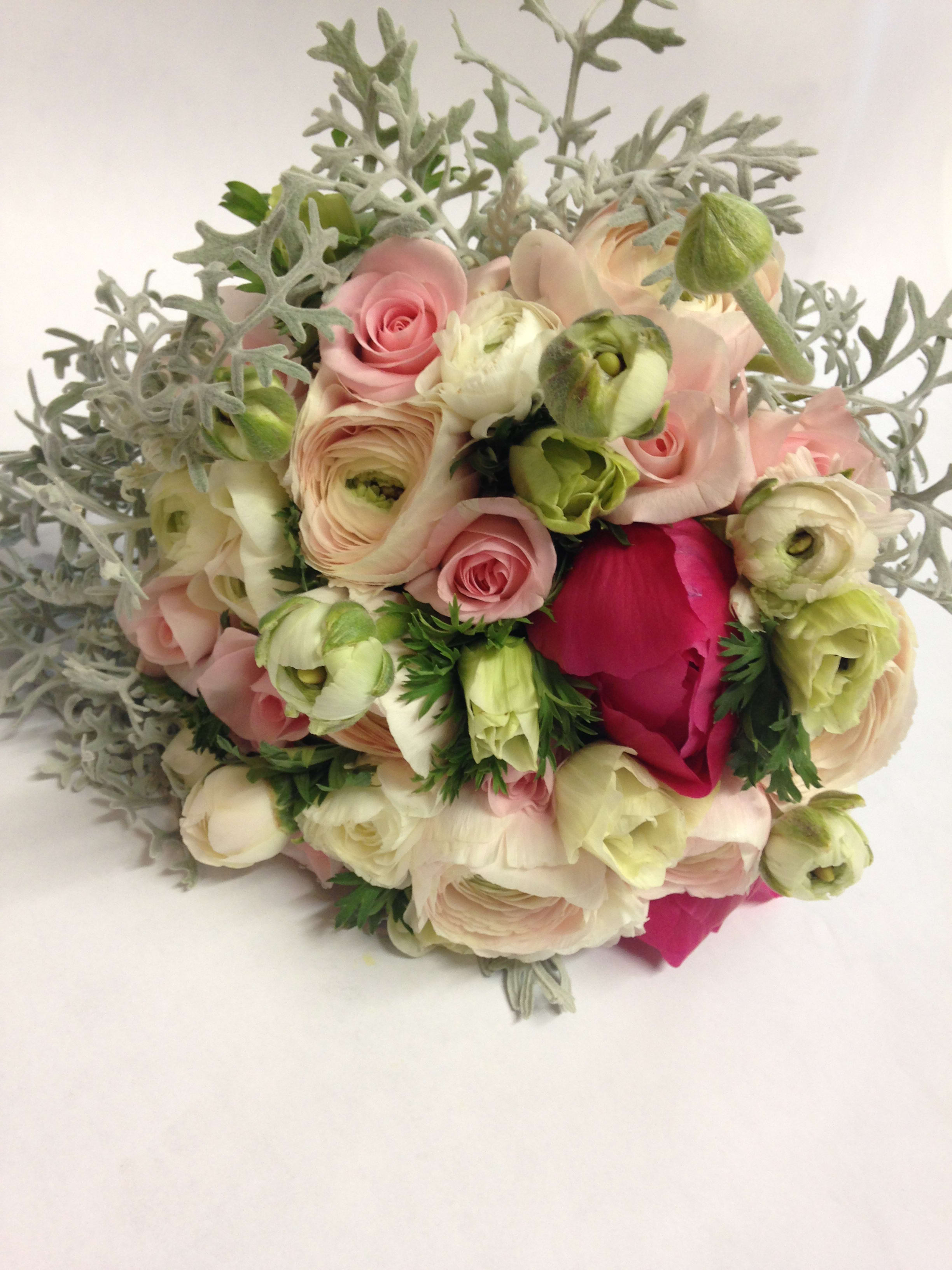 Bouquet of pale pink and cream flowers with silvery foliage