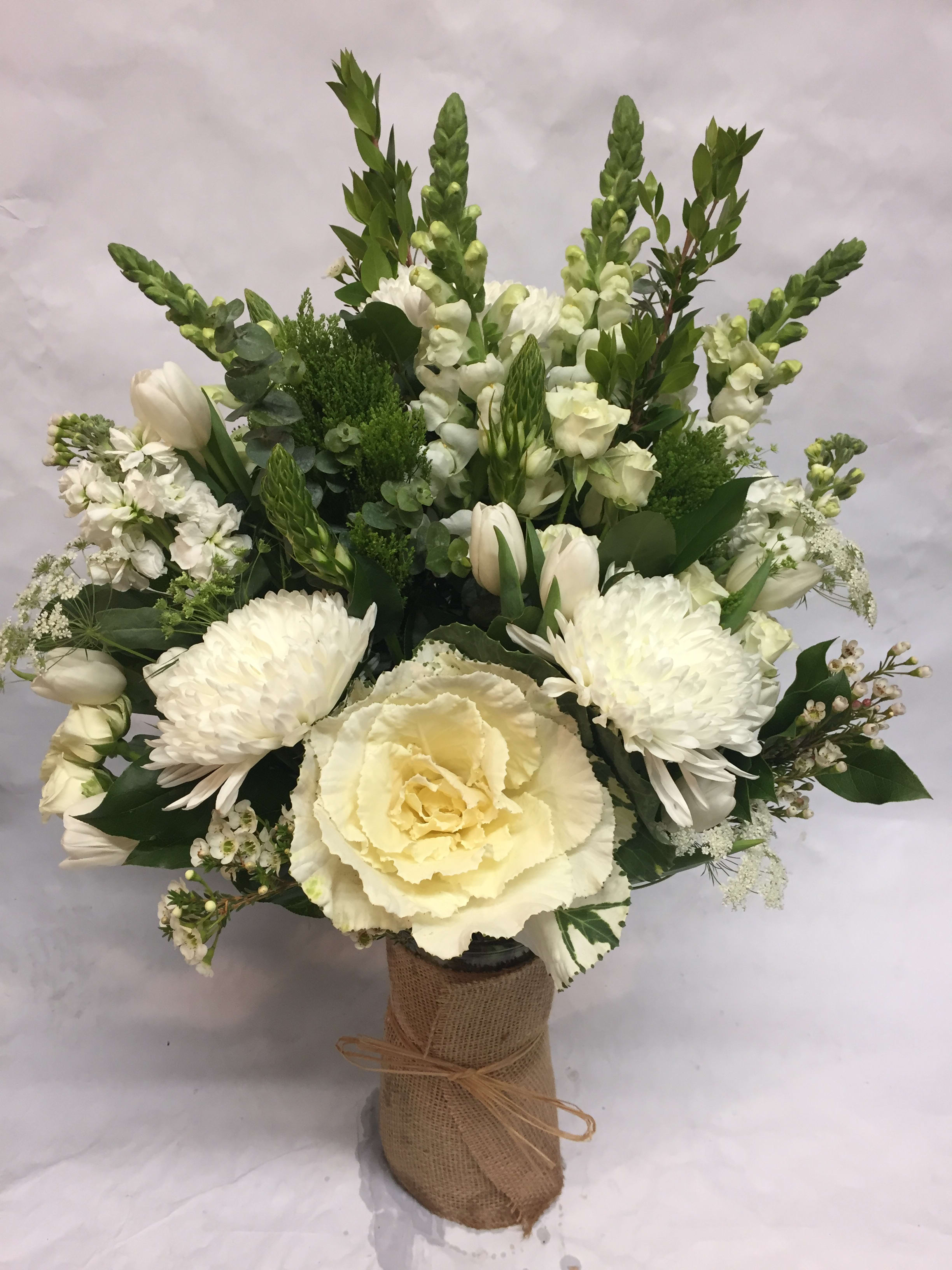 White floral bouquet with tulips, chrysanthemums, and a large cream rose