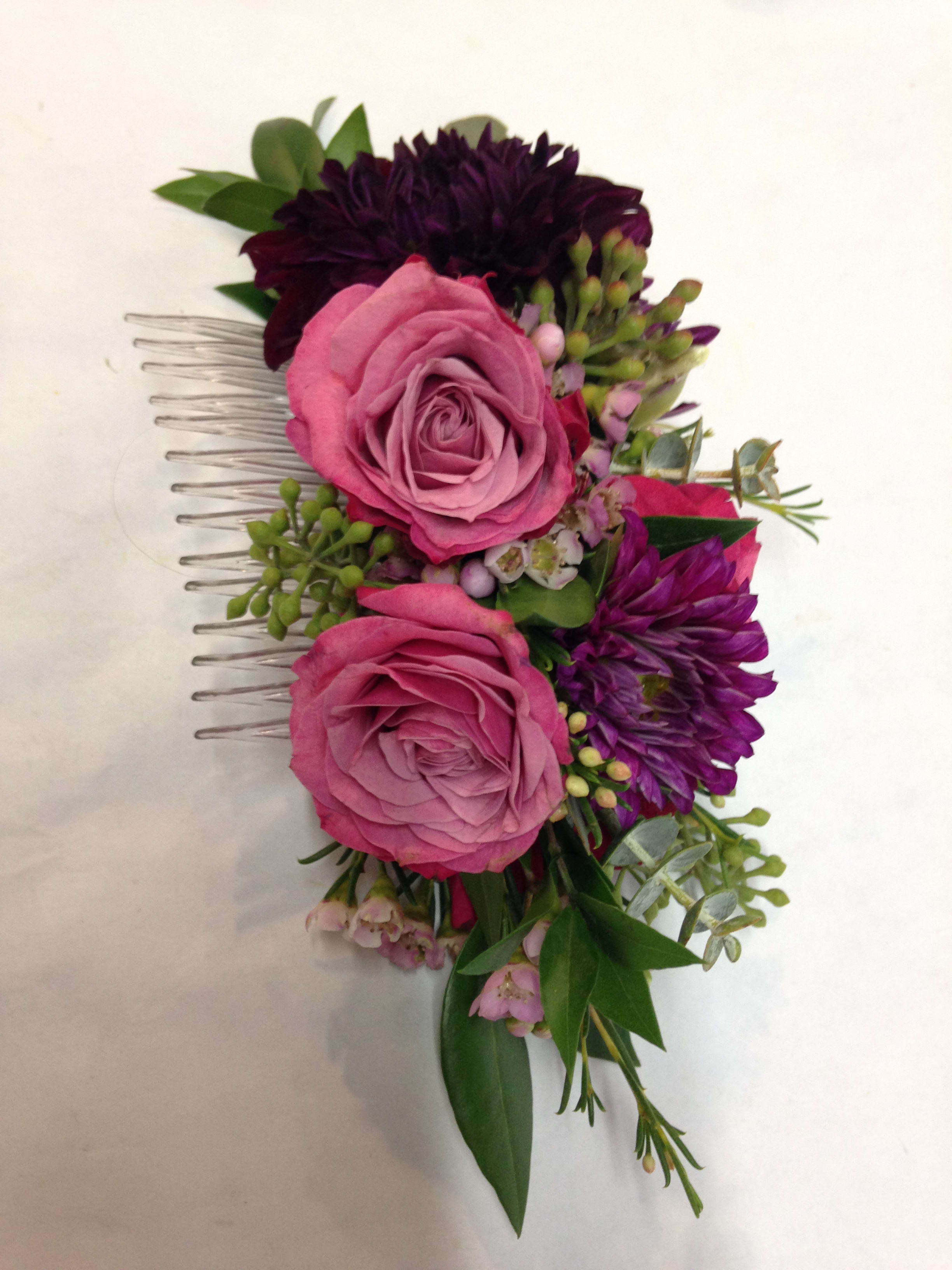 Pink and purple floral hair comb with roses and small blooms