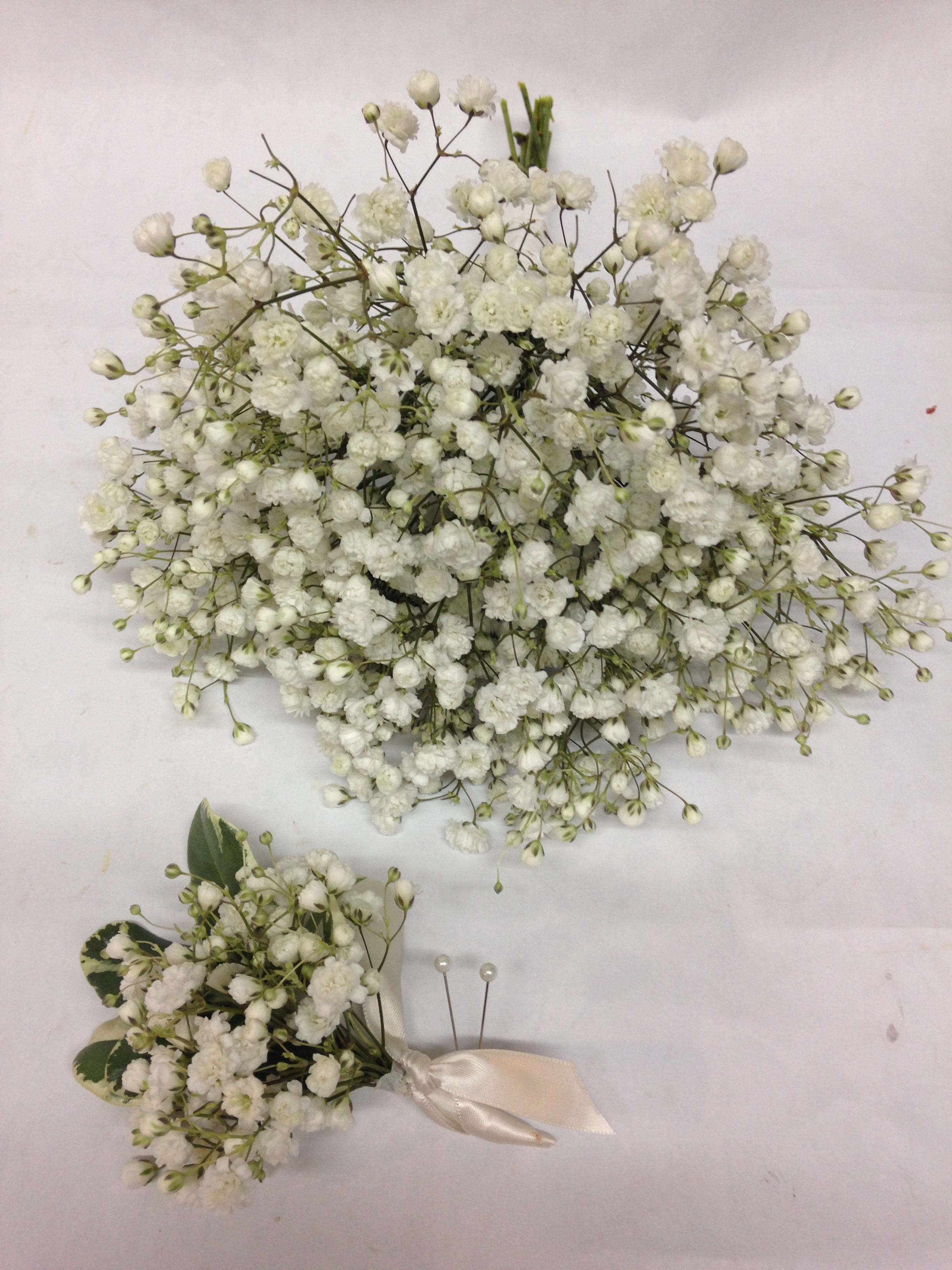 White baby's breath bouquet and matching boutonniere with satin ribbon