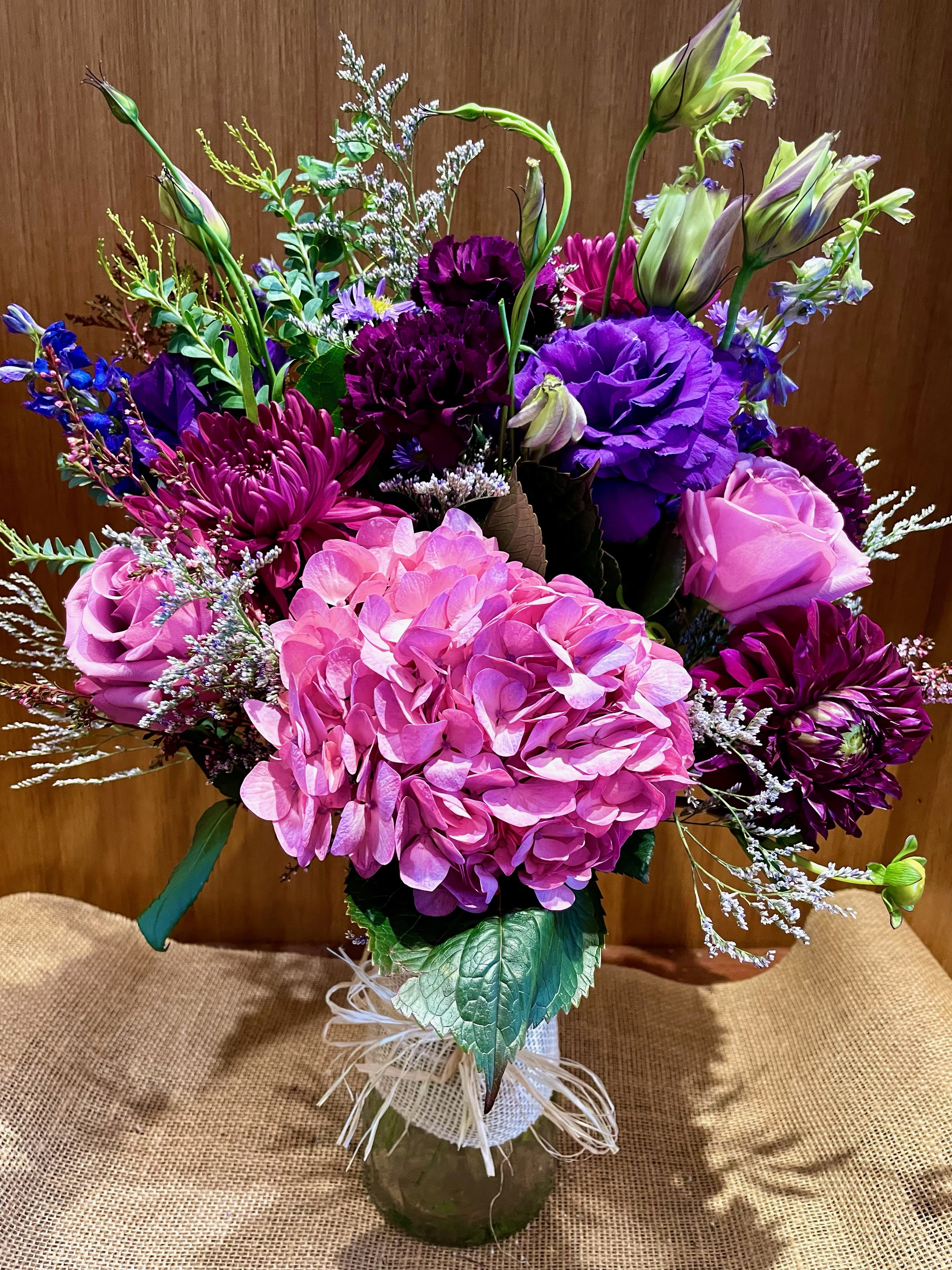 Bouquet of pink and purple flowers in a glass vase