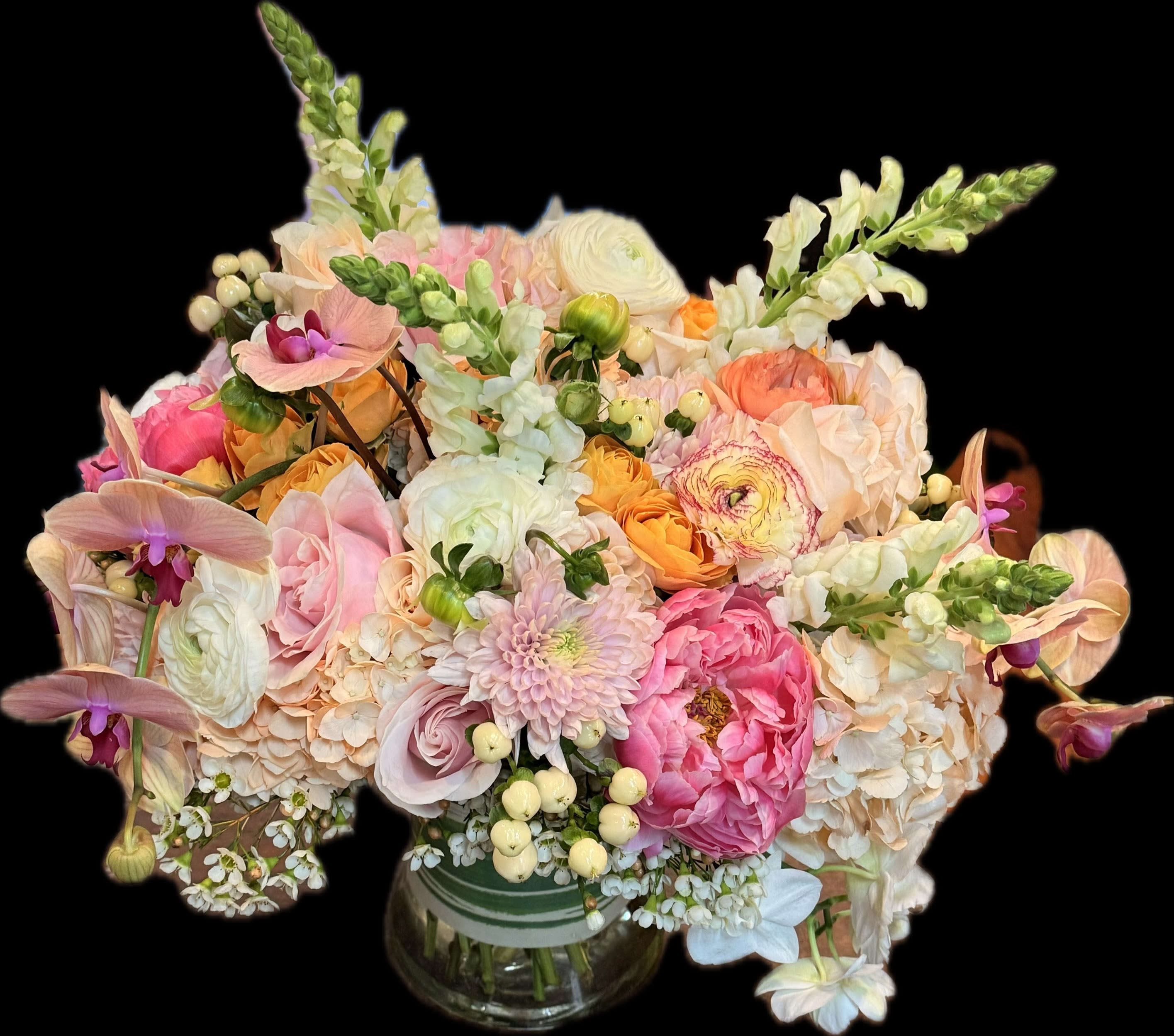 Pastel mixed flower bouquet in a glass vase