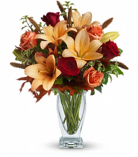Fall Fantasia Bouquet - Roses, lilies, and oak leaves create a fantasy of fall colors. Send this tall, elegant arrangement to wish someone a happy autumn or joyous Thanksgiving.  Approximately 17 inches wide and 20 inches tall for the Standard size.