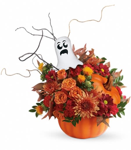 Spooky Surprise Pumpkin Bouquet - Don't be afraid! This hauntingly cute pumpkin bouquet is the perfect gift to give this Halloween! With its lush red and orange blooms in a food-safe pumpkin vase, it's floating ghost pick completes the spooky look! Approximately 15 1/2 inches wide and 19 inches tall.