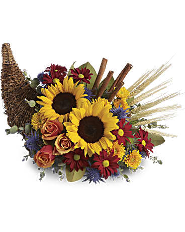 Sunflower and rose arrangement with daisies in a woven basket