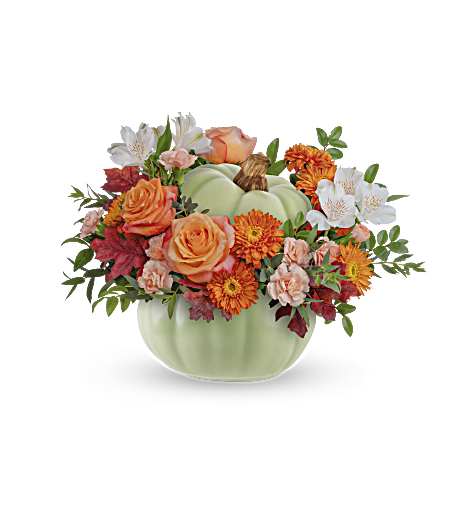 Whimsy Pumpkin Bouquet - This whimsical arrangement of fall roses comes in a beautiful sage colored ceramic pumpkin. Filled to the brim with gorgeous seasonal flowers now, this cute food-safe pumpkin can be used later as a candy dish! Approximately 15 1/2 inches wide and 11 1/2 inches tall for the Standard size.