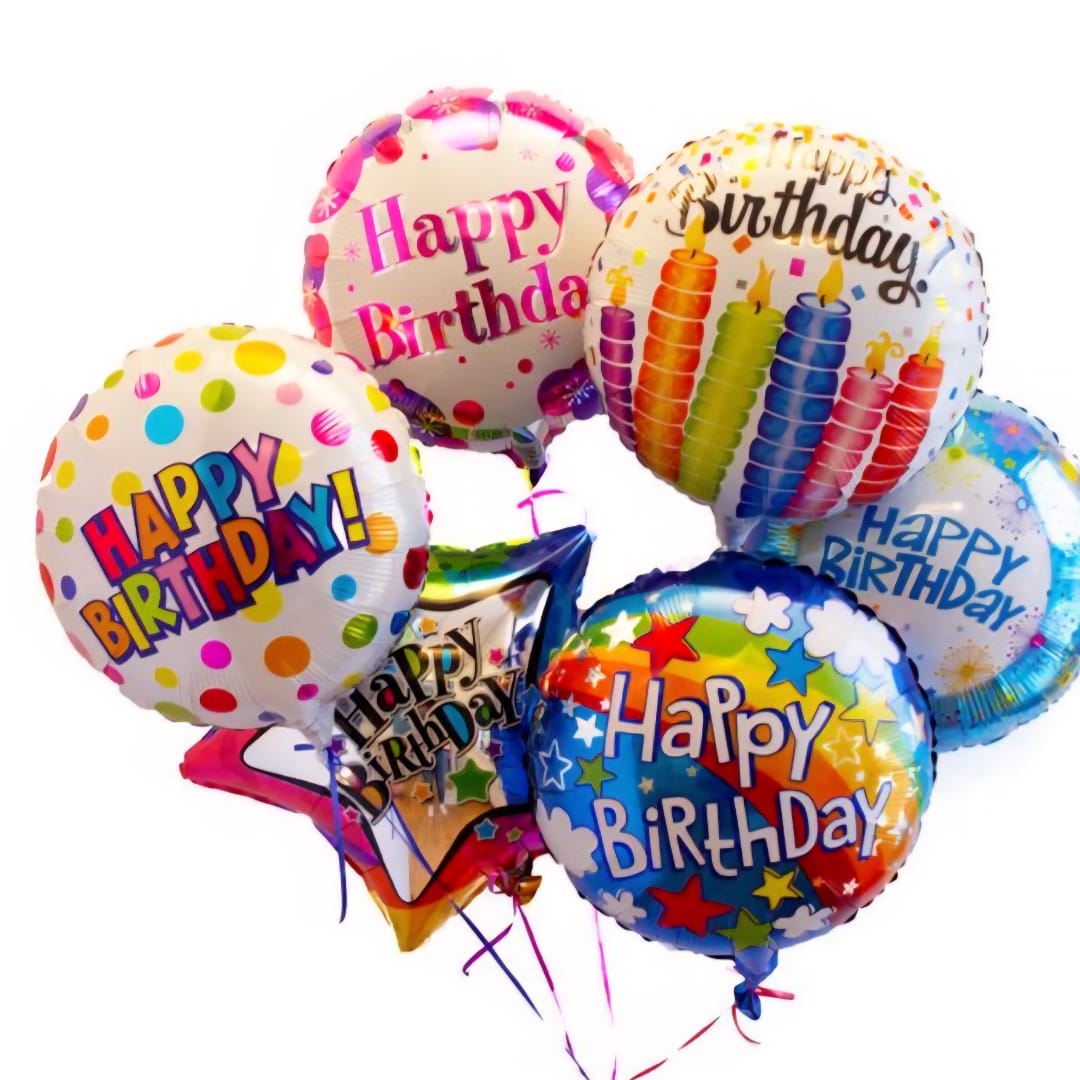 Cluster of colorful birthday balloons with printed messages