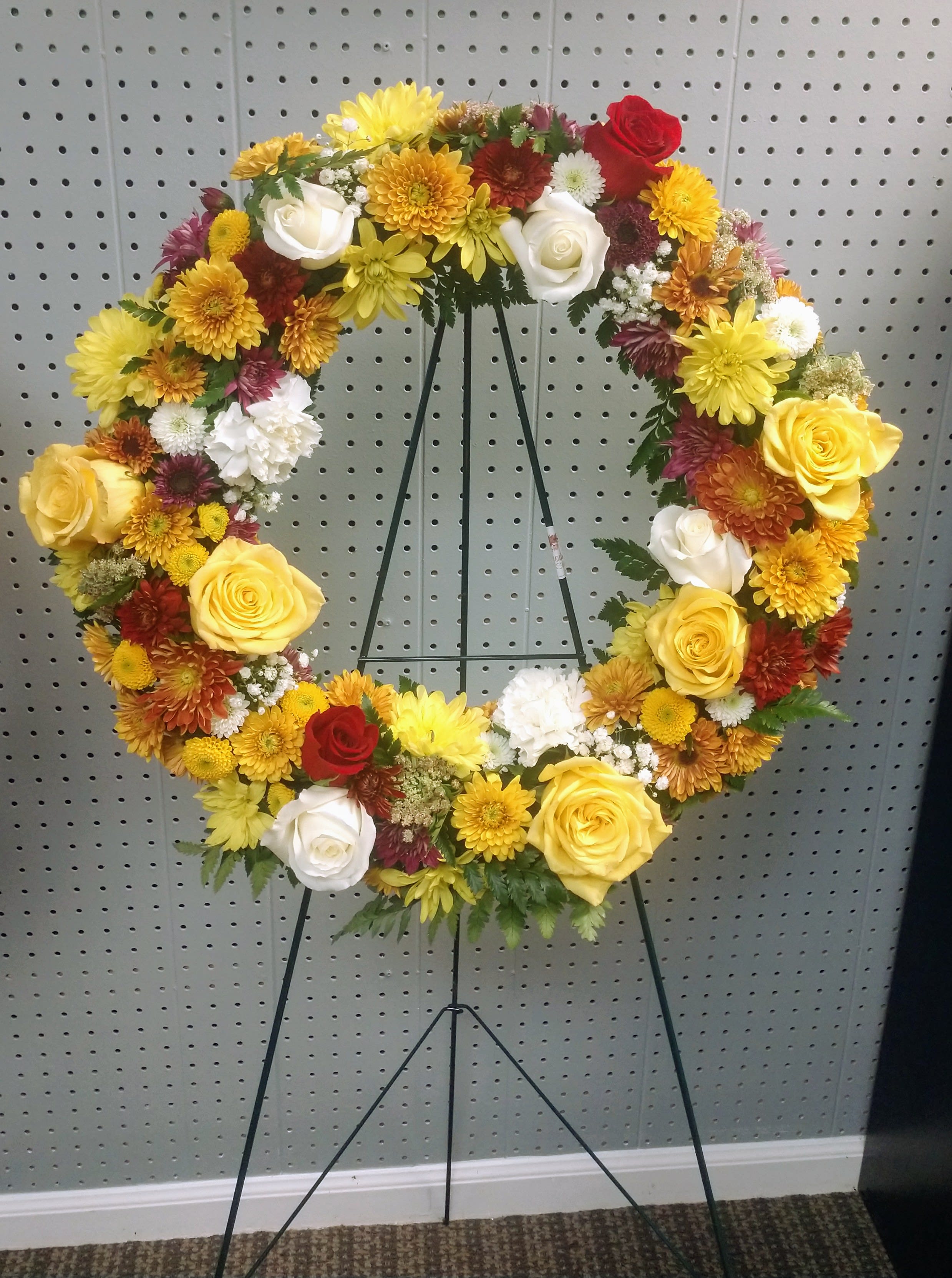 Fall Tribute Wreath - Beautiful in-season blooms such as daisies, roses and chrysanthemums in fall colors. 