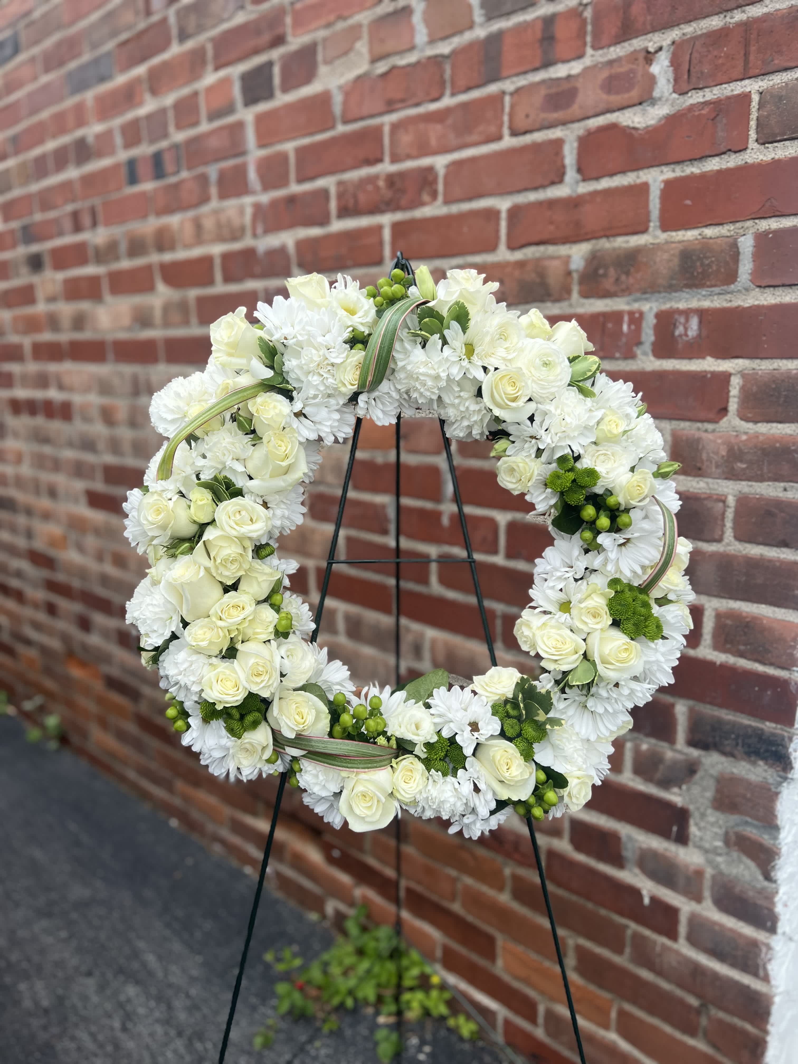 Lasting Serenity - A beautiful white and green tribute wreath that calms, this easel arrangement celebrates a full life and a peaceful passing. 