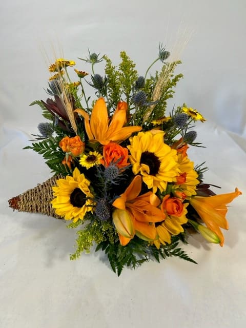 Orange and yellow mixed bouquet with sunflowers and lilies