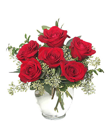 Rosey Romance)Half Dozen - If you're looking for a way to show your love, but you know grand gestures aren't their style, Rosey Romance is the arrangement to send! A half dozen short stem, red roses say "I love you" with all the grandeur of their long-stemmed counterparts in a smaller package!Standard: 6 Roses. Deluxe:12 Roses. Premium: 18 Roses. 