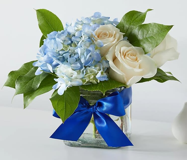 Sky Blue Delight Bouquet - These ivory roses and sky–blue blooms will brighten anyone's day.