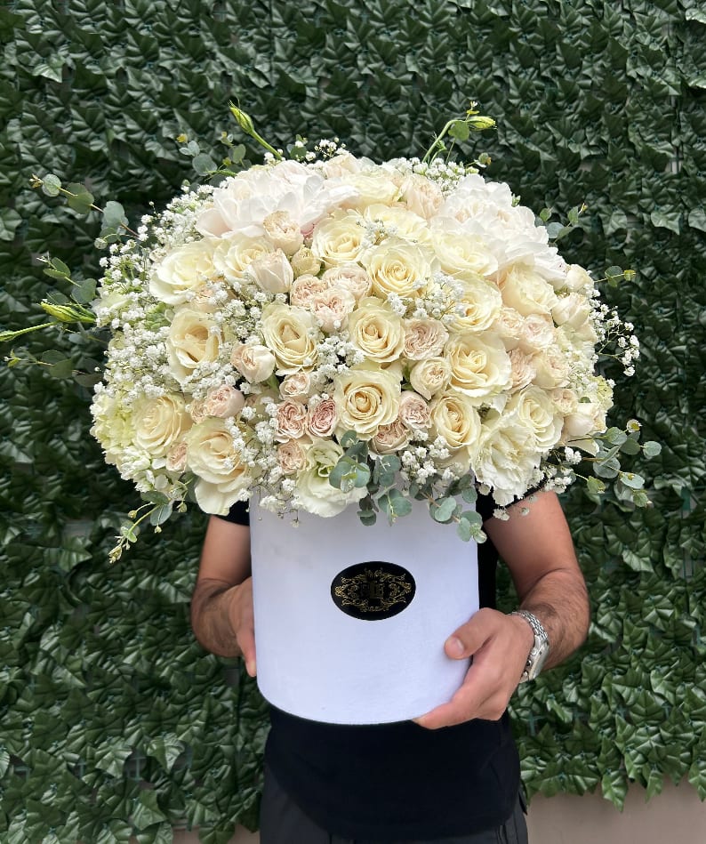 Large cream rose bouquet in a white hat box