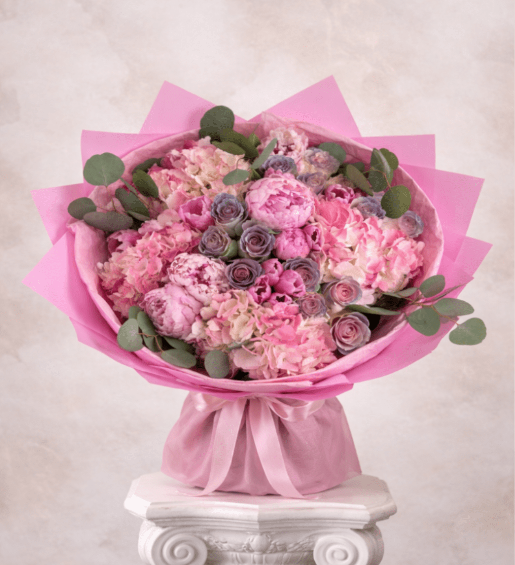 Pink bouquet of hydrangeas and roses with eucalyptus