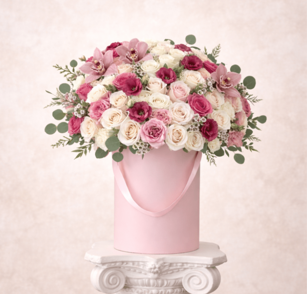 Pink and white rose bouquet in a pink hatbox