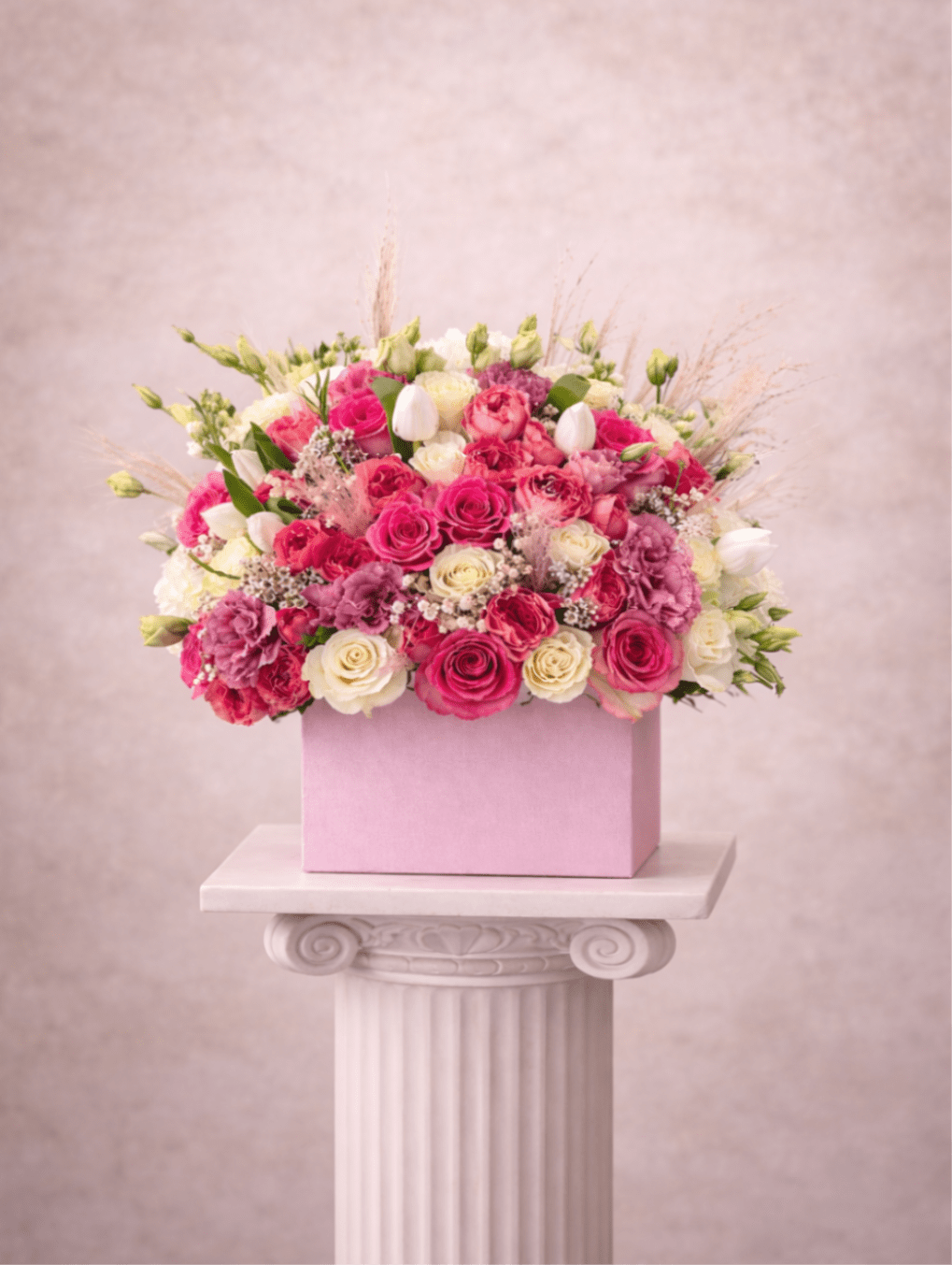 Bubble Gum - Brighten any space with our Elegant Flower Box Arrangement! Bursting with vibrant blooms, this stunning display combines seasonal favorites with lush greenery.   Housed in a chic, reusable container, it makes a perfect centerpiece for any occasion be it a gift or a treat for yourself. Elevate your decor with this captivating arrangement that brings joy and sophistication to your home or office. Order yours today and let the beauty of flowers inspire you