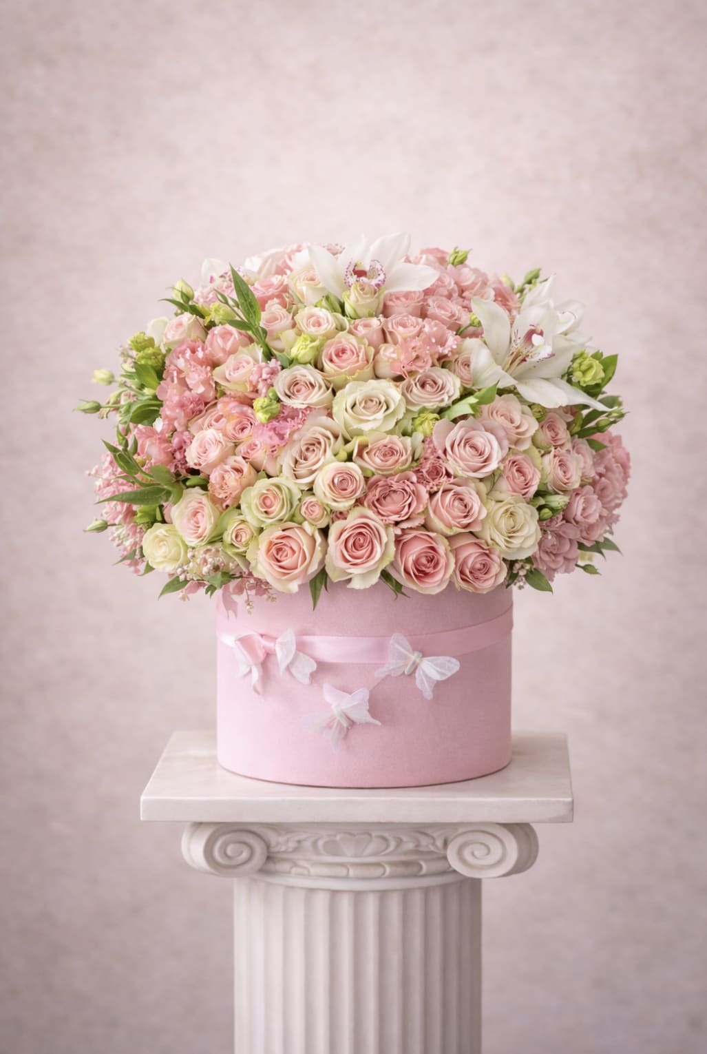 Butterfly - Brighten any space with our Elegant Flower Box Arrangement! Bursting with vibrant blooms, this stunning display combines seasonal favorites with lush greenery.   Housed in a chic, reusable container, it makes a perfect centerpiece for any occasion be it a gift or a treat for yourself. Elevate your decor with this captivating arrangement that brings joy and sophistication to your home or office. Order yours today and let the beauty of flowers inspire you