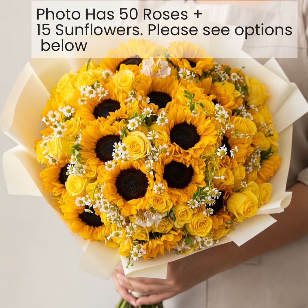 Yellow bouquet with sunflowers, roses, and small white daisies wrapped in cream paper