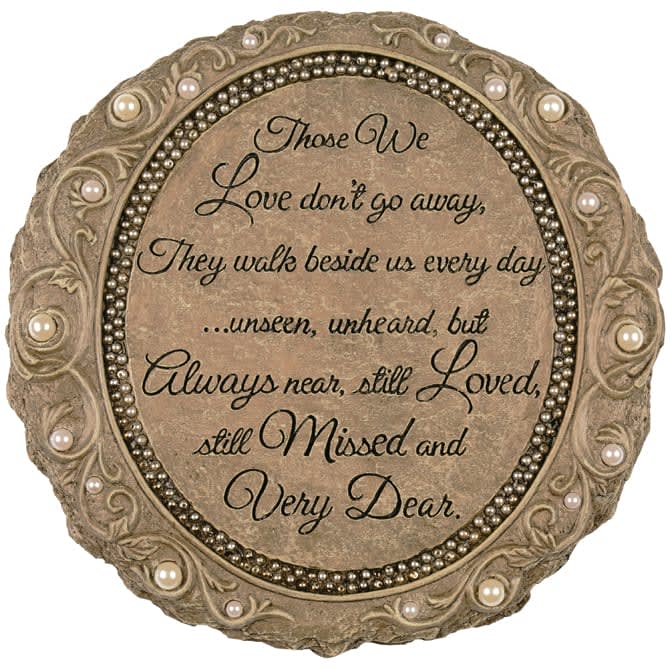 Round memorial plaque with a sympathy quote and pearl-like accents