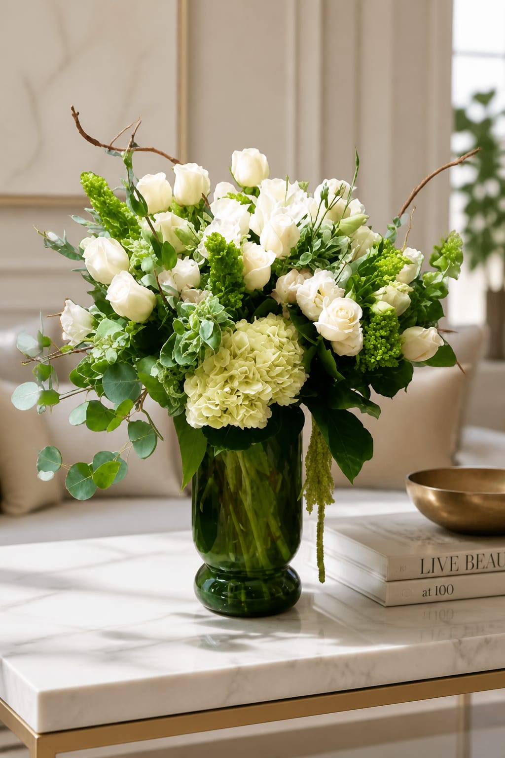 White roses and hydrangea in a green glass vase