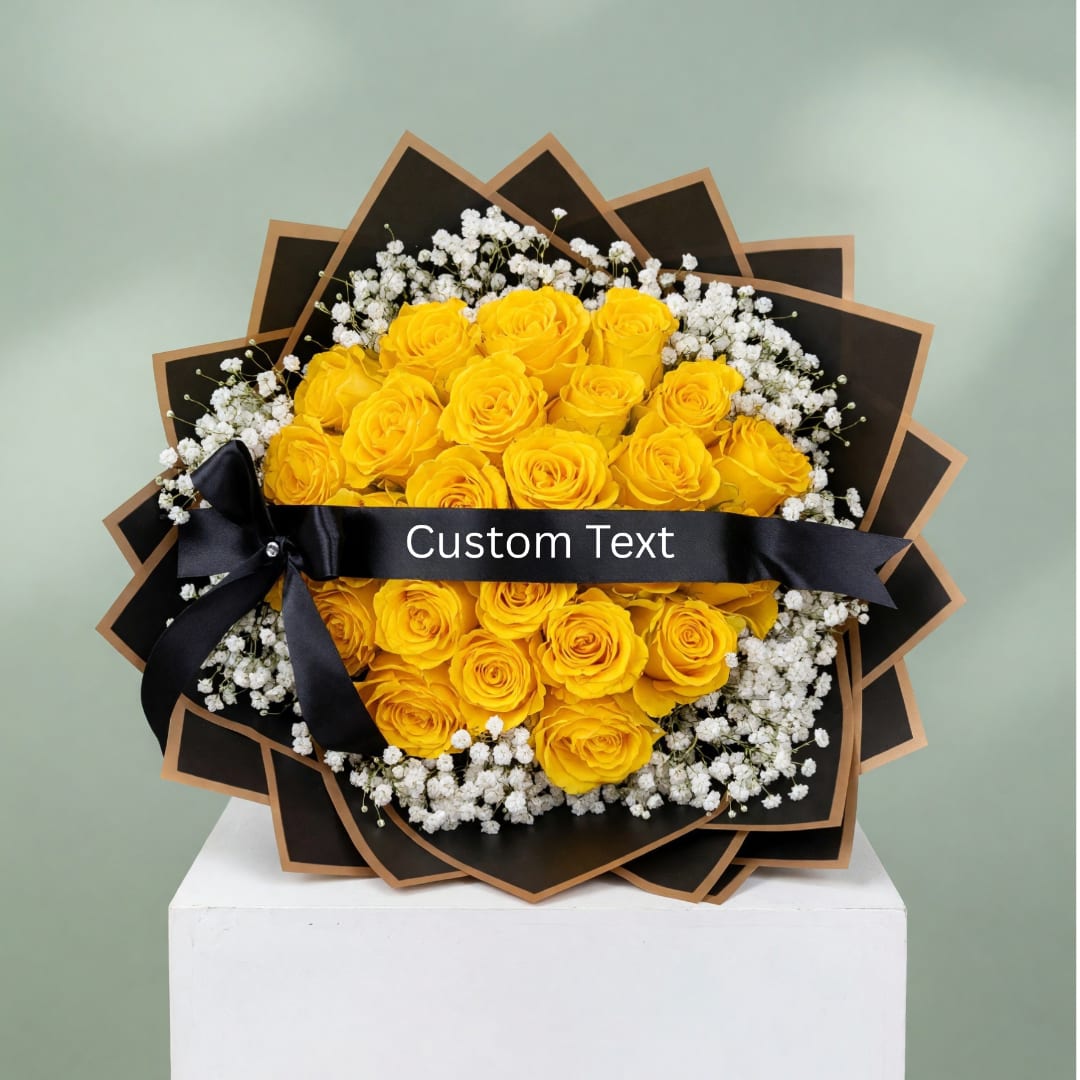 Yellow roses arranged with white baby's breath and a black ribbon