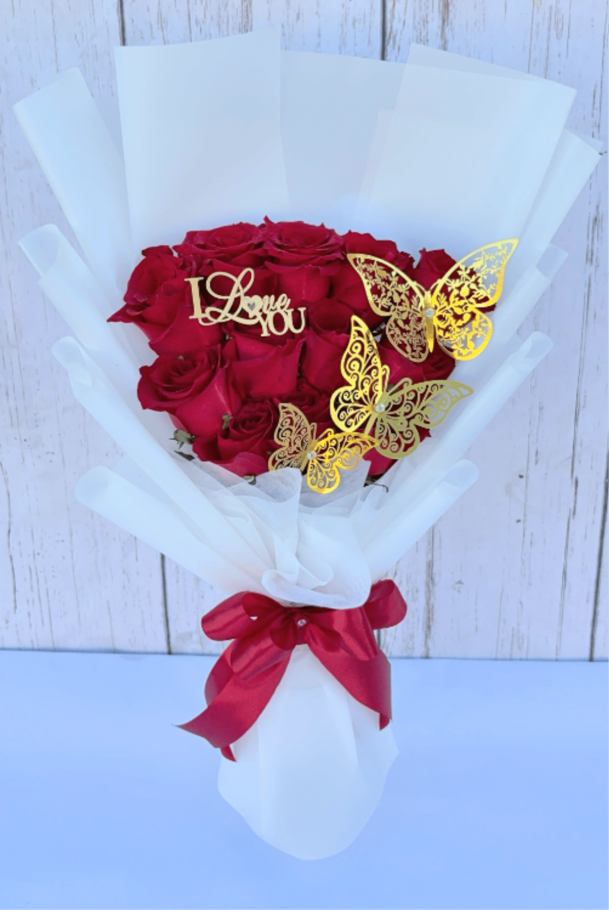 Small Bouquet 12 Red Roses - 12 red roses adorned with golden butterflies and an "I Love You" sign.
