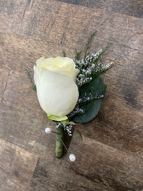 White Rose Boutonnière - A classic white boutonnière that compliments any suit. A perfect addition for any prom, formal, or wedding event. 