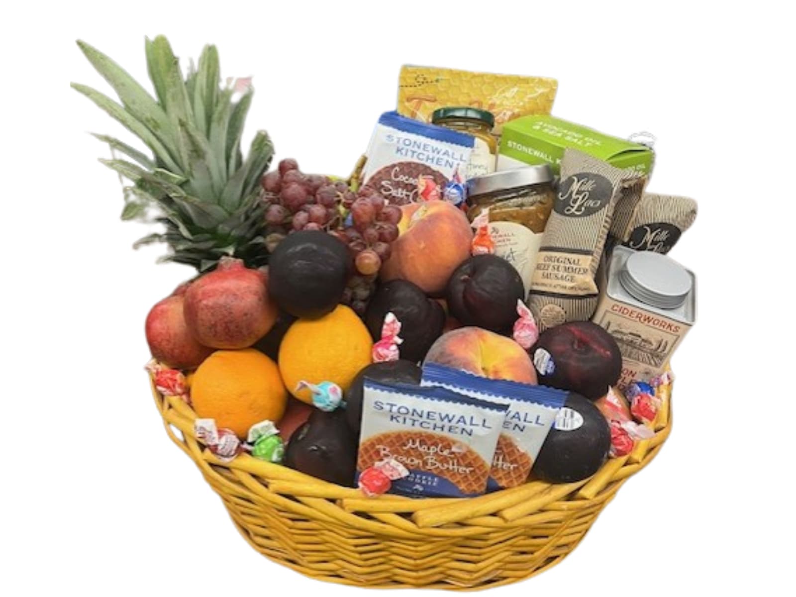 Fruit and snack gift basket with pineapple, grapes, oranges, and packaged treats