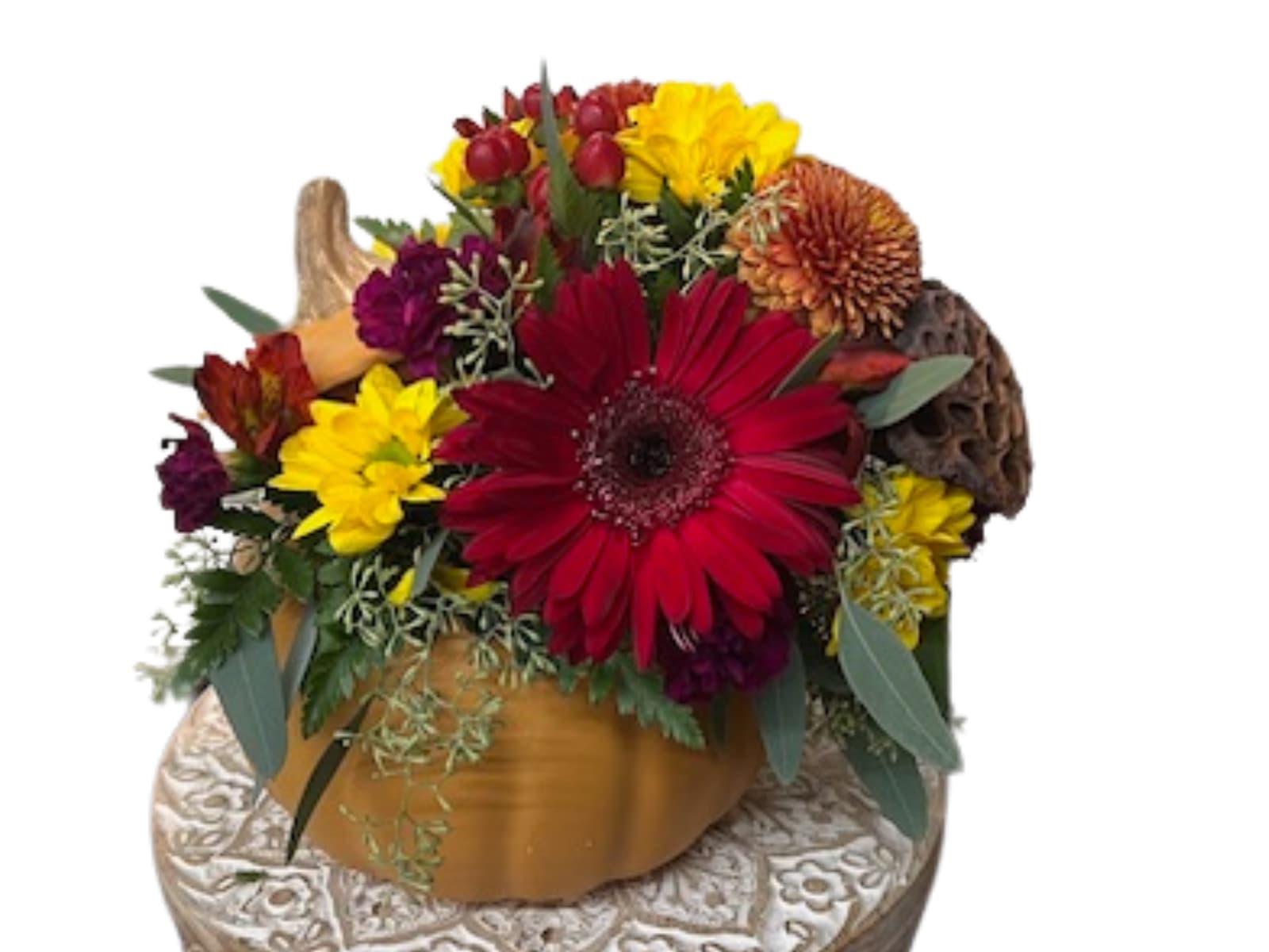 Pumpkin Spice - These fall flowers are delightfully arranged inside a ceramic pumpkin.