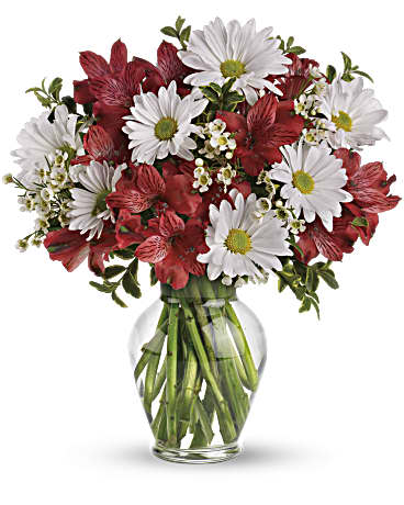 Red and white mixed bouquet in a clear glass vase