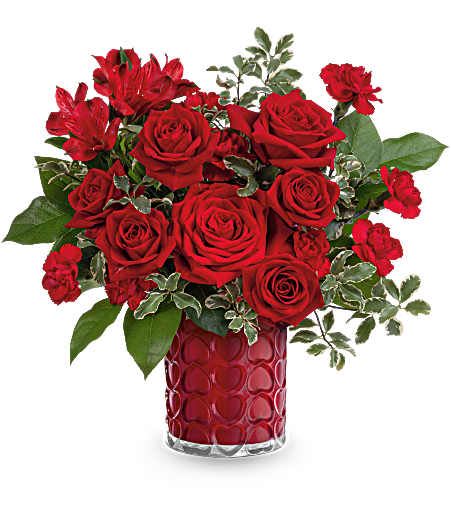 Red roses and carnations in a red textured vase