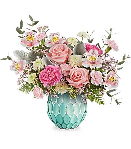 Dream In Color Bouquet - Evoking the beauty of colorful dreams, this enchanting rose bouquet is showcased in a frosted turquoise vase with a mercury-inspired finish and sculpted details. Approximately 16 inches wide and 13 1/2 inches tall for the Standard size.