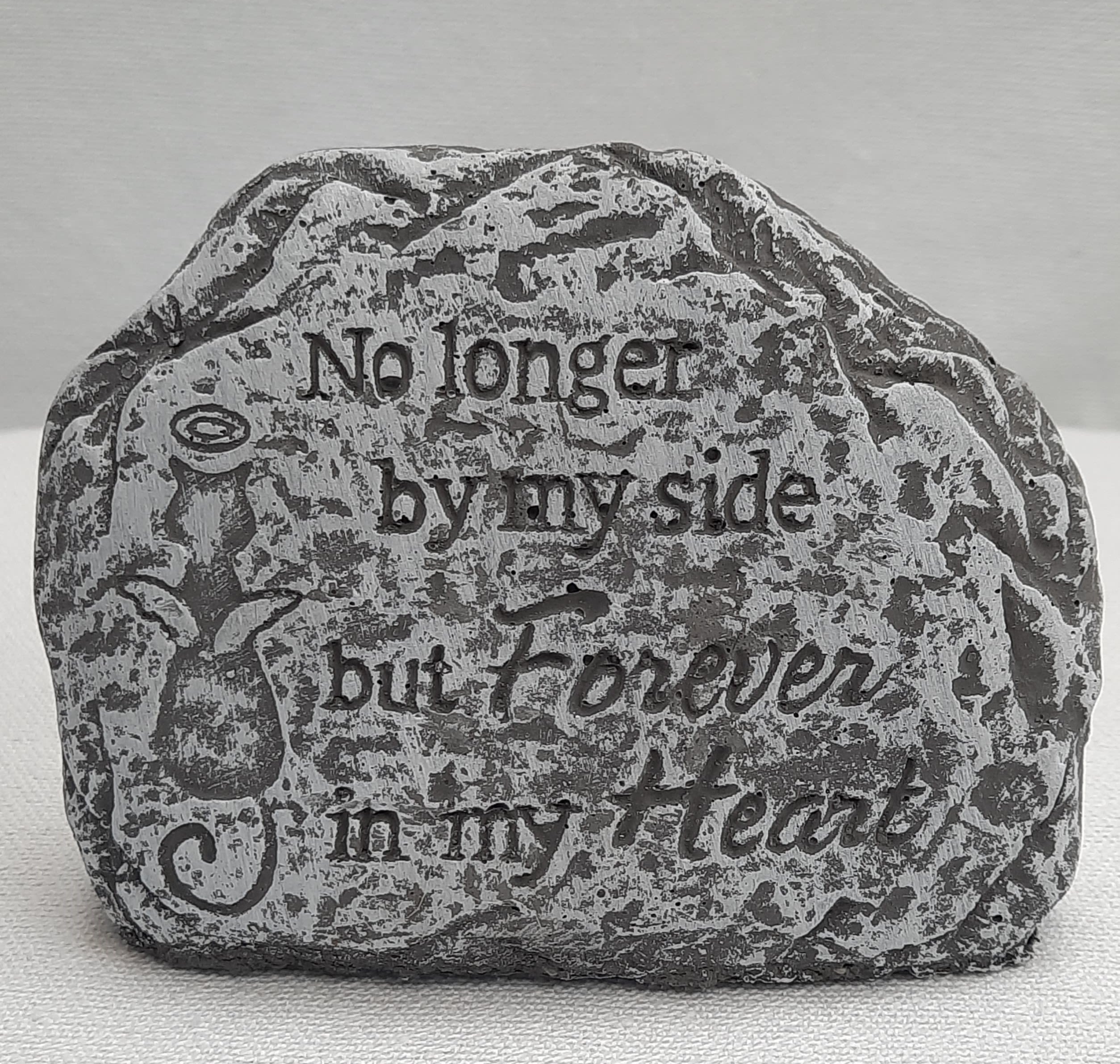 Decorative stone with the words "No longer by my side but forever in my heart"