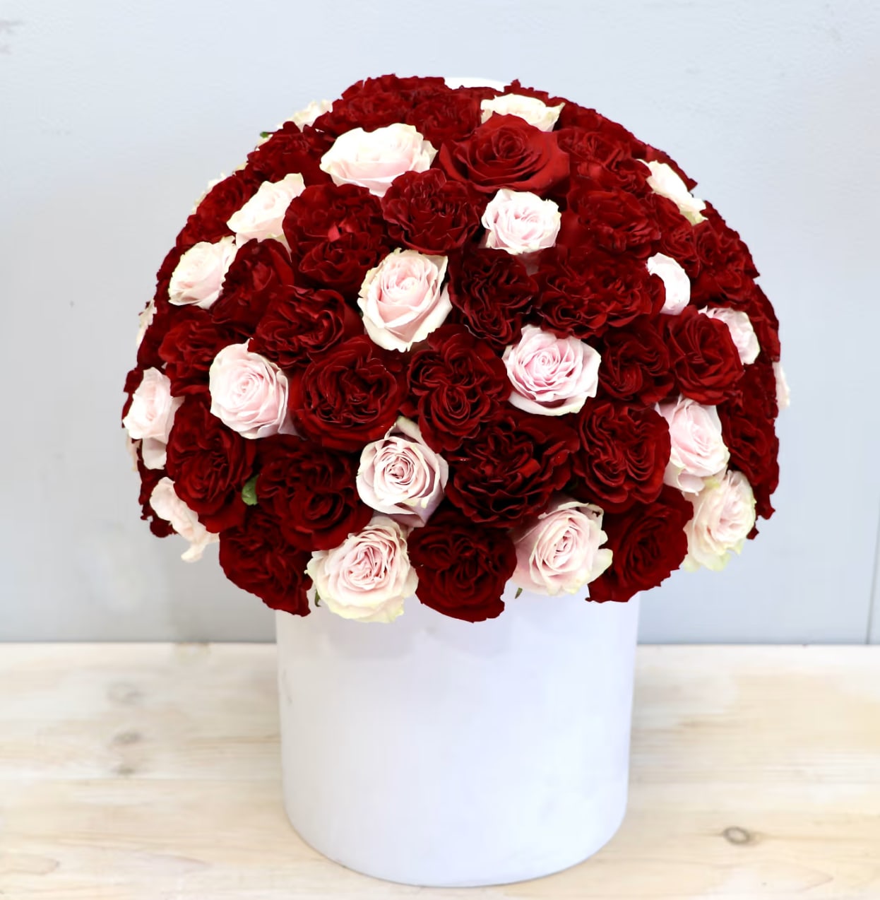 Red &amp; Pink Roses Hat Box - WeHo - 50 Premium Ecuadorian red and pink roses perfectly arranged in our new velvet hatbox!  Make sure to upgrade to deluxe(75 roses) or premium(100 roses) for more roses!