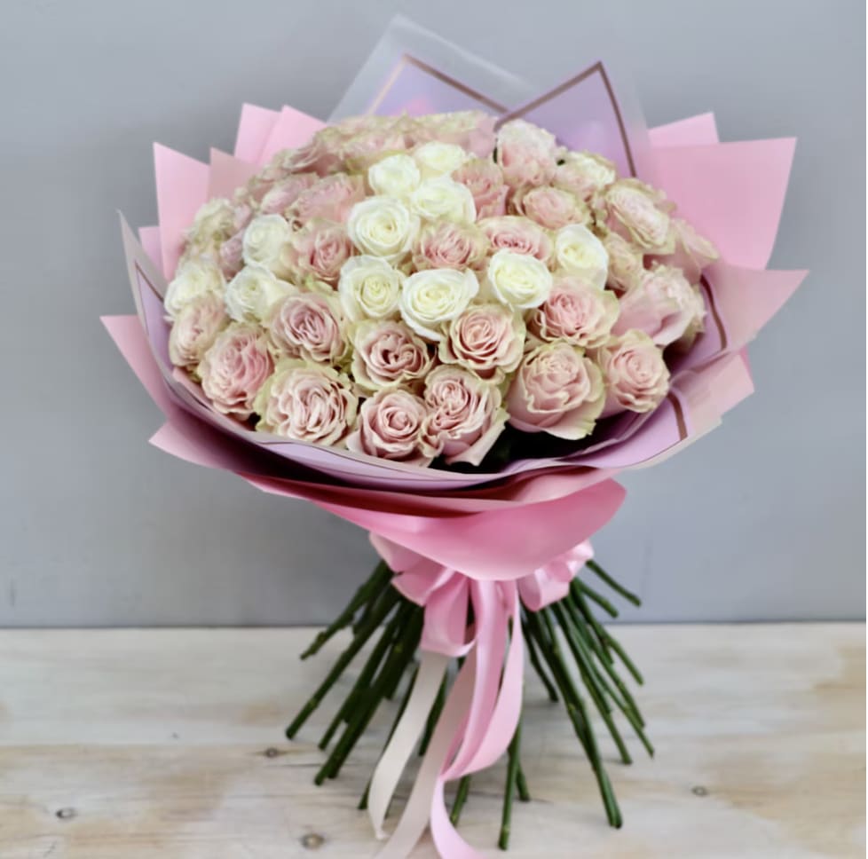 Wrapped Rose Bouquet - Weho  - This wrapped bouquet comes with 50 pink roses carefully wrapped in pink wrapping paper. Each upgrade comes with 25 more roses.