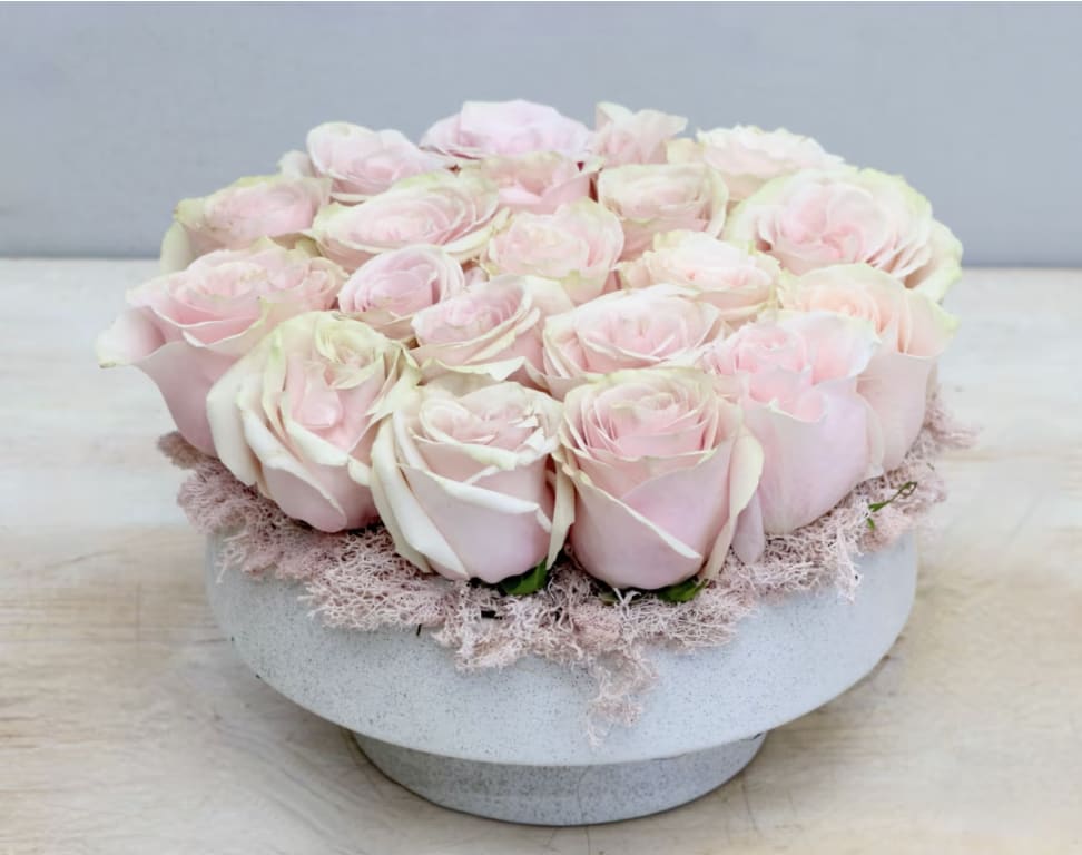 Blush and Bloom - Weho  - This chic arrangement comes with about 20 premium pink mundial roses, in the standard size, in a ceramic vase. Only two sizes available, don't forget to upgrade for more blooms!