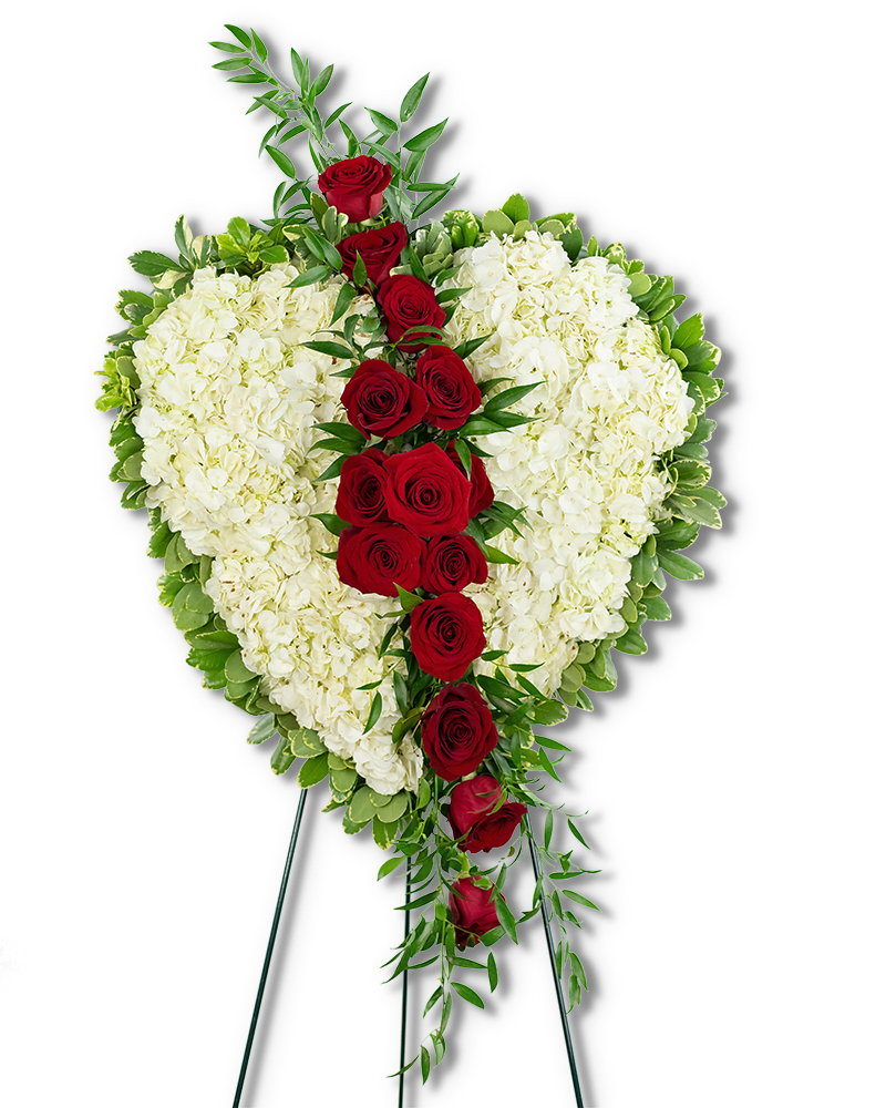 Heart-shaped standing arrangement of white flowers with a cascade of red roses.