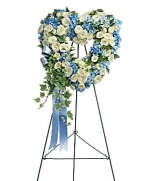 Pure Heart - Adorned with trailing ivy this petite 16" sweet heart-shaped wreath of sky blue hydrangea and pure white roses is a loving remembrance.