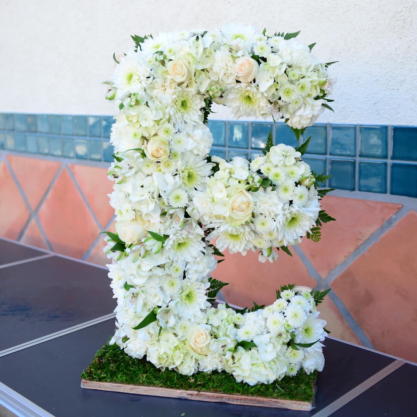 24" Letter - This is our new product. Each letter is 24" tall and covered in a variety of flowers. You can choose any letter and any color. Please allow at least 3 days to prepare these letters.  The price is per letter.  Please call in to order your letter. 