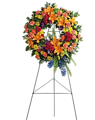 Colorful Serenity Wreath - A rainbow of love. Celebrate your colorful memories of a beautiful life with this radiant wreath of hydrangea roses and lilies.