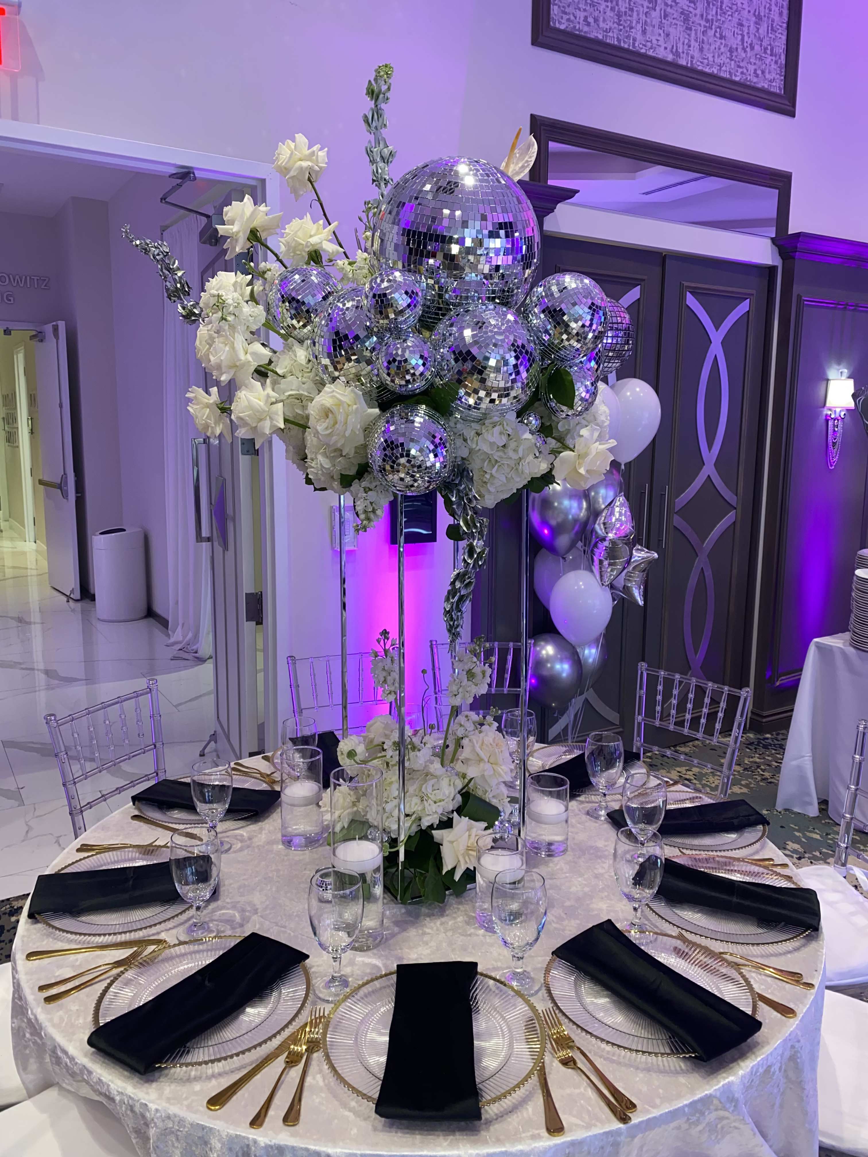 White disco party  - Decoration with variety of white flowers and disco balls. Arrangements of different sizes and shapes. Please contact us personally to have your quote 