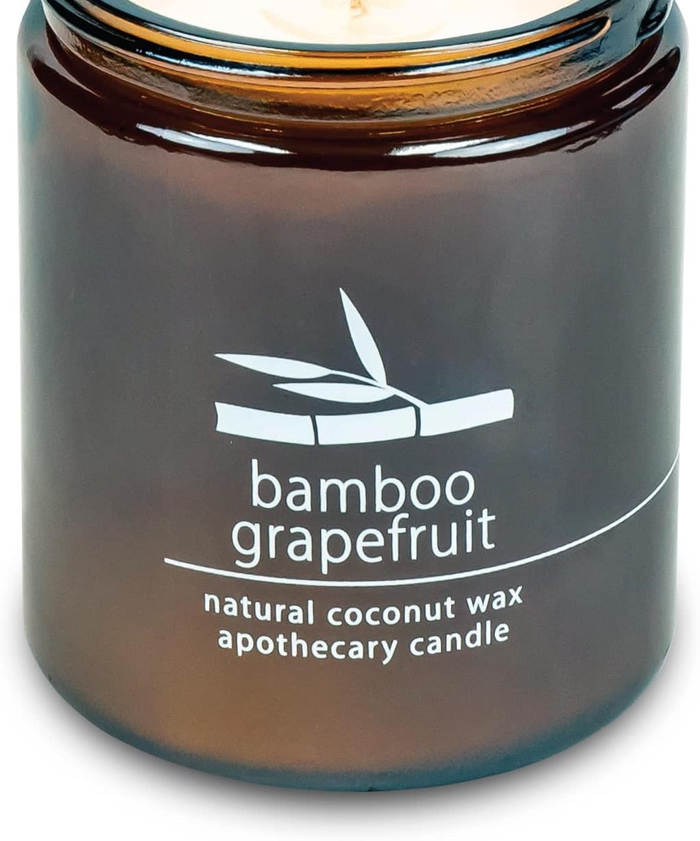 Brown glass candle jar labeled bamboo grapefruit