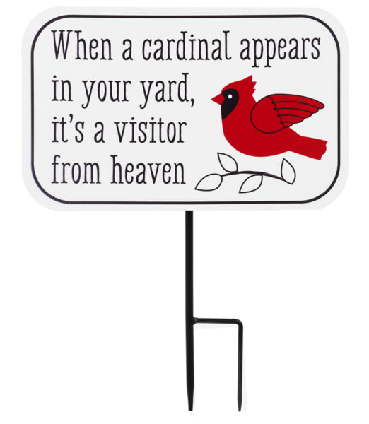 Yard sign with a red cardinal and memorial text