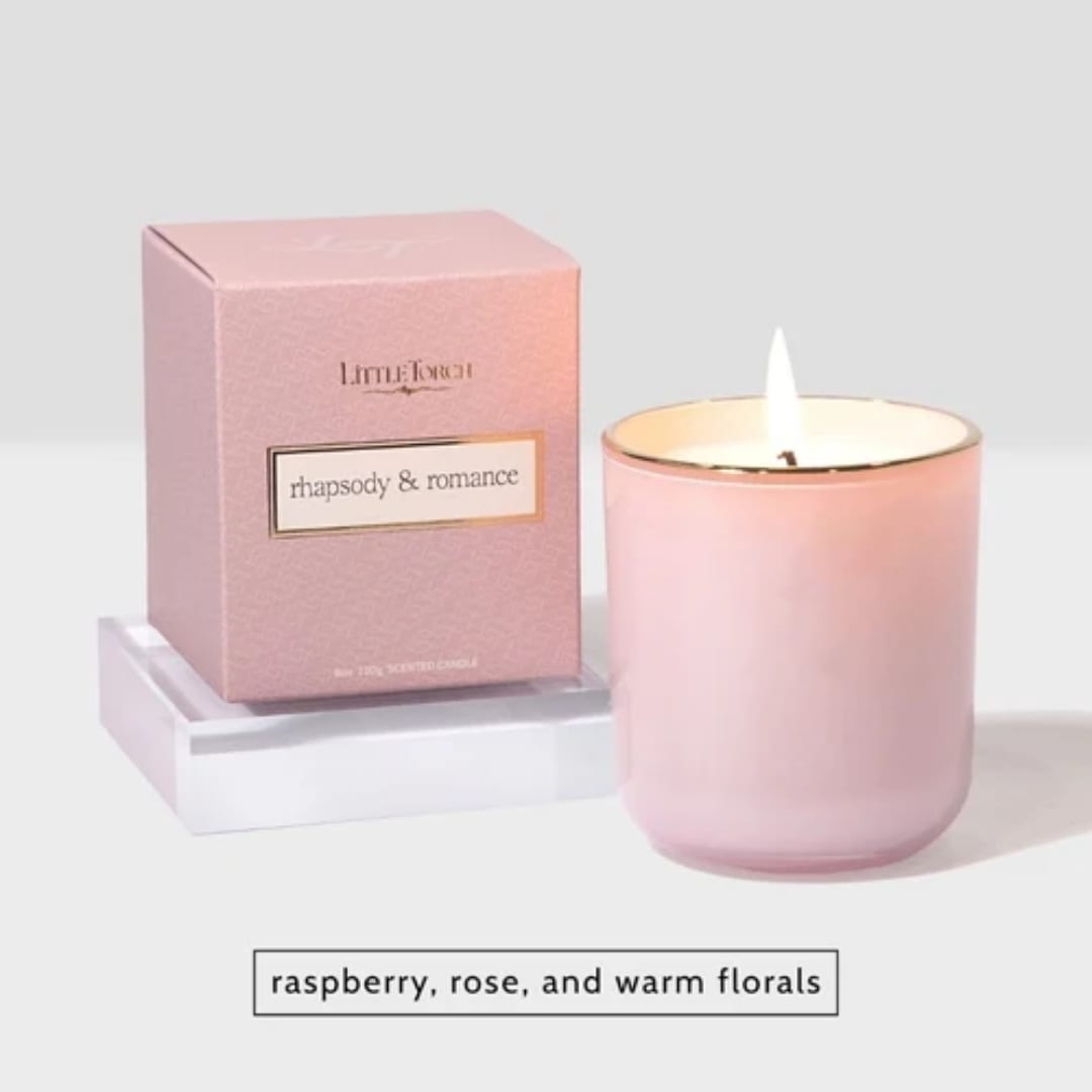 Pink scented candle in a glass jar with matching box