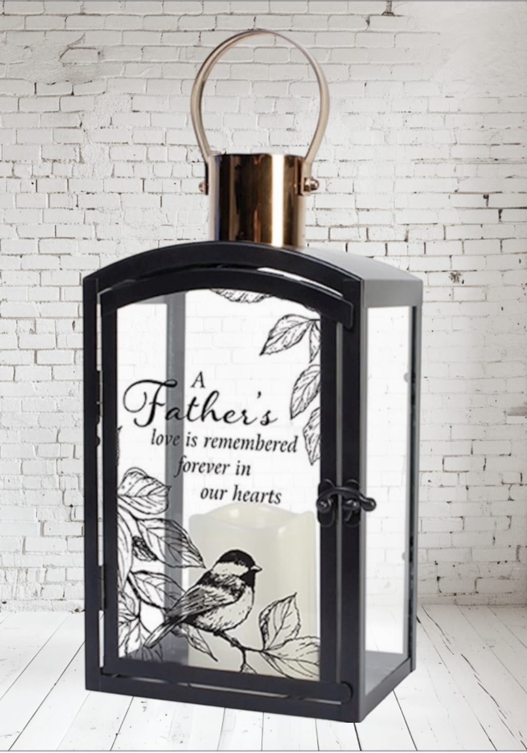 Black lantern with a memorial candle and father tribute text