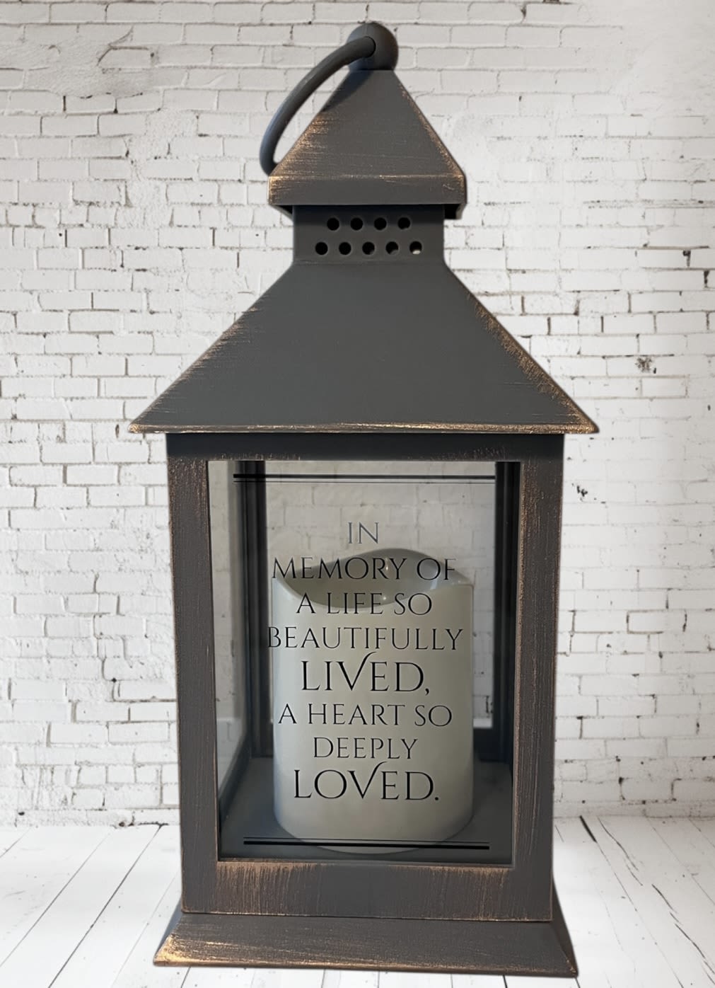 Decorative lantern with a memorial candle inside