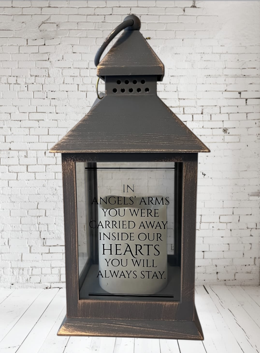 Decorative lantern with a memorial quote inside