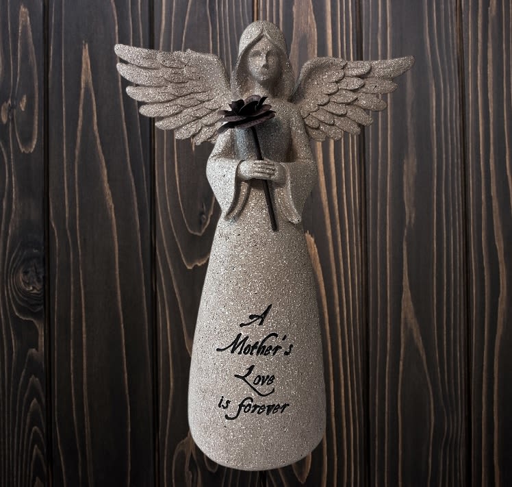 Glittery angel figurine holding a black flower with "A Mother's Love is forever" text